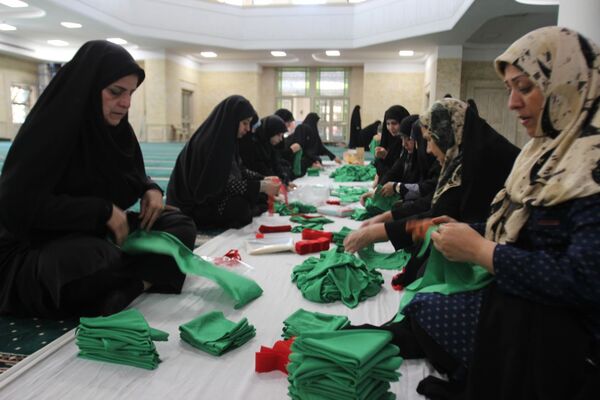 بسته‌بندی لباس همایش شیرخوارگان حسینی زنجان