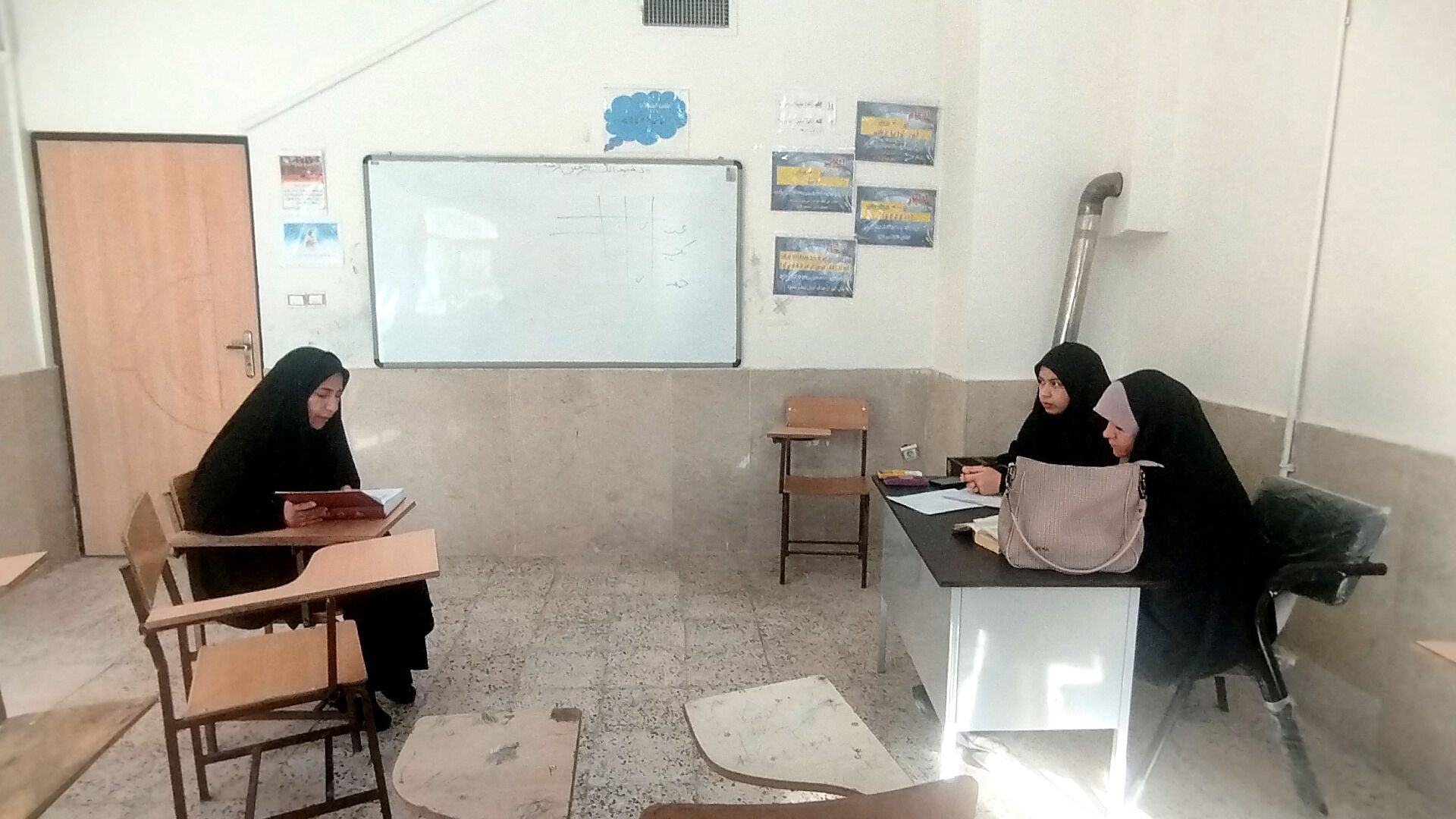 برگزاری آزمون قرآن و عترت در رشته حفظ و قرائت در آشخانه