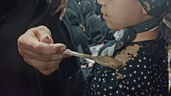 آیین سنتی «گل مالی» در روز عاشورا