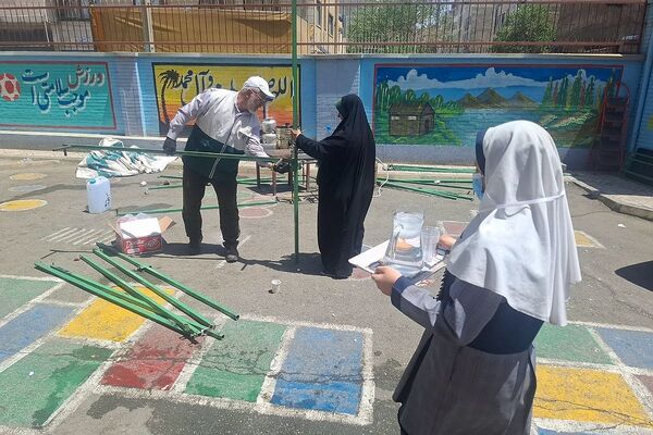 مراسم  پرچم گردانی  بارگاه حضرت علی بن موسی‌الرضا (ع) در مدرسه باهنر ملارد به مناسبت دهه کرامت