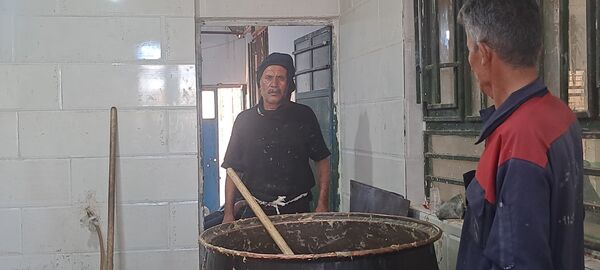 پخش نذری ظهر عاشورا در روستای حسن آباد بلهر 