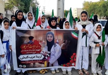 دختران تکواندوکار میناب بر مزار شهیده ارینا عرب‌کیش حاضر شدند