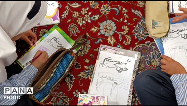 نمایشگاه تصاویر شهدای جنگ رمضان در روستای مومن آباد قم
