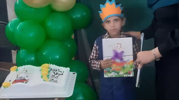 مراسم عهد و پیمان با قرآن در دبستان قمر بنی هاشم شهرستان زارچ 
