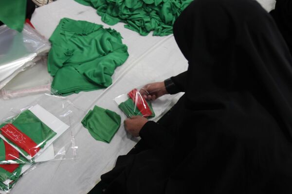 بسته‌بندی لباس همایش شیرخوارگان حسینی زنجان