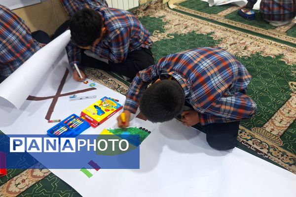 برپایی نقاشی همگانی در هفته ماها در آموزشگاه معارف۶ ناحیه ۳شیراز 