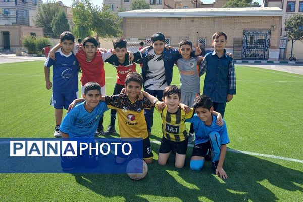 آیین افتتاحیه زمین چمن مصنوعی دبستان علی بن ابیطالب (ع) باقرشهر 